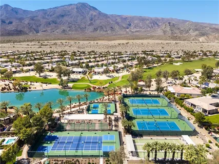 an aerial view of residential houses and outdoor space