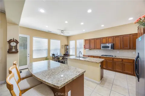 a kitchen with stainless steel appliances granite countertop a stove and a sink