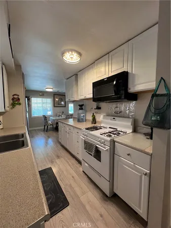 a view of hallway with wooden floor
