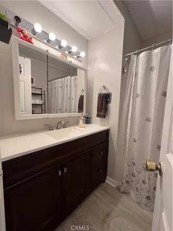 a bathroom with a toilet a sink and a shower