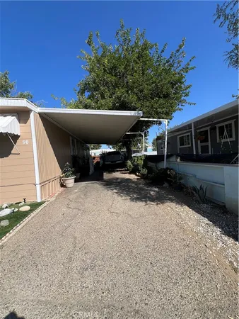 a view of house with outdoor space and car parked