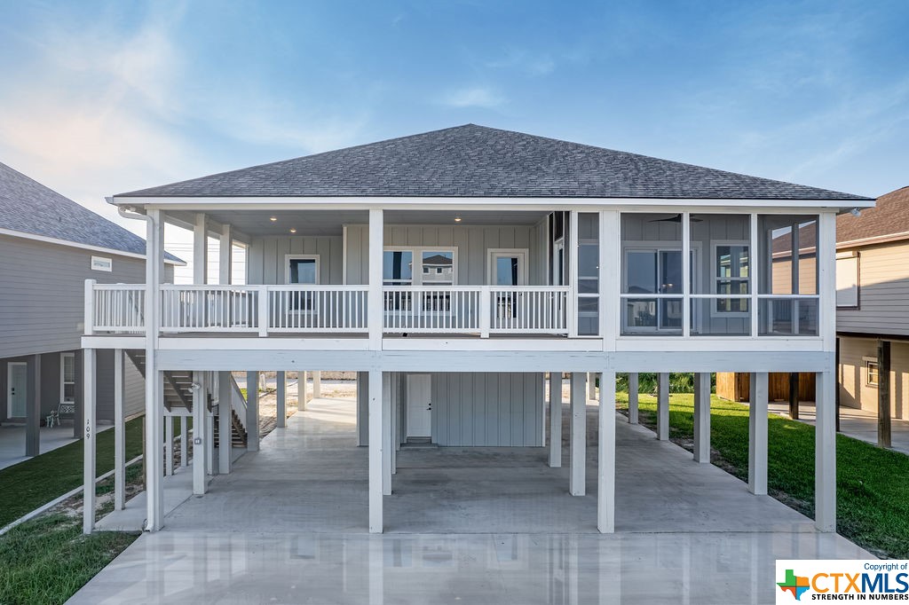 a front view of a house with a deck