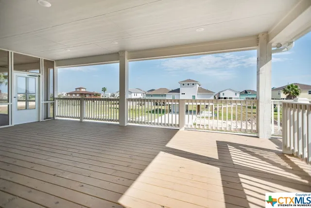 a view of a balcony with wooden floor