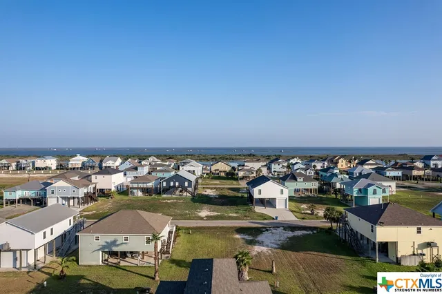 a aerial view of a house with a yard