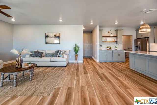 a spacious bedroom with a bed and furniture