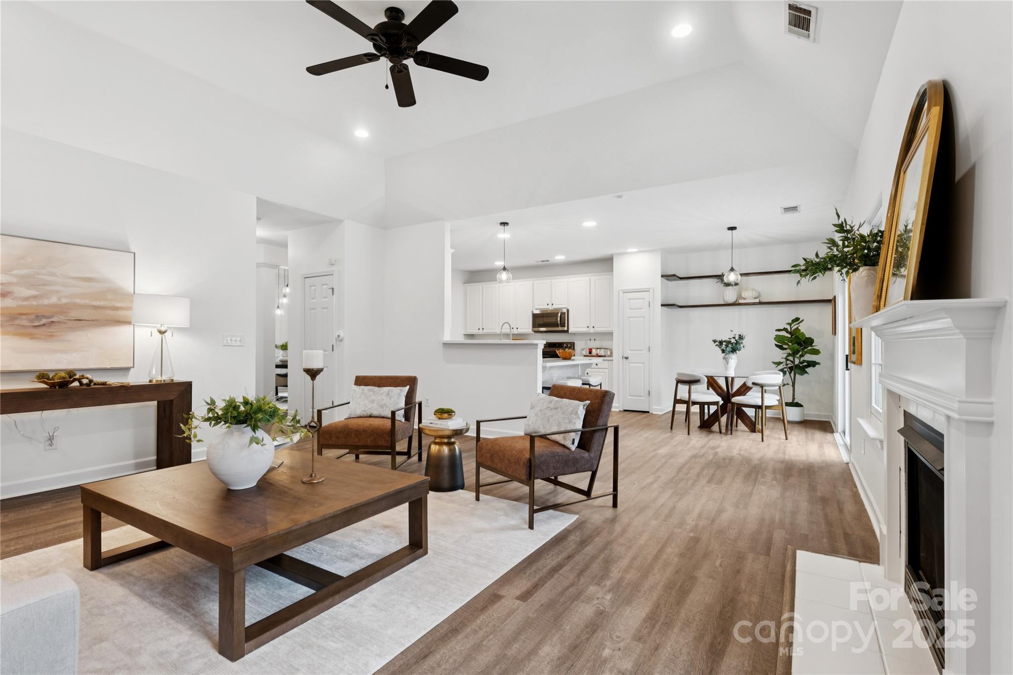 312 Albany Street Fort Mill, SC 29715 - Photo 15 of 36 a living room with furniture a fireplace and a flat screen tv