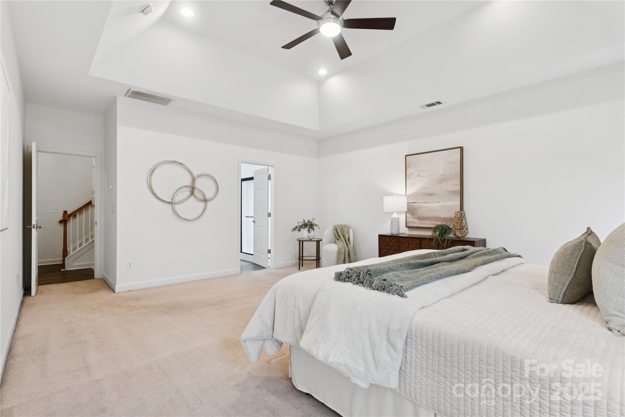 312 Albany Street Fort Mill, SC 29715 - Photo 17 of 36 a bedroom with a bed and a chandelier