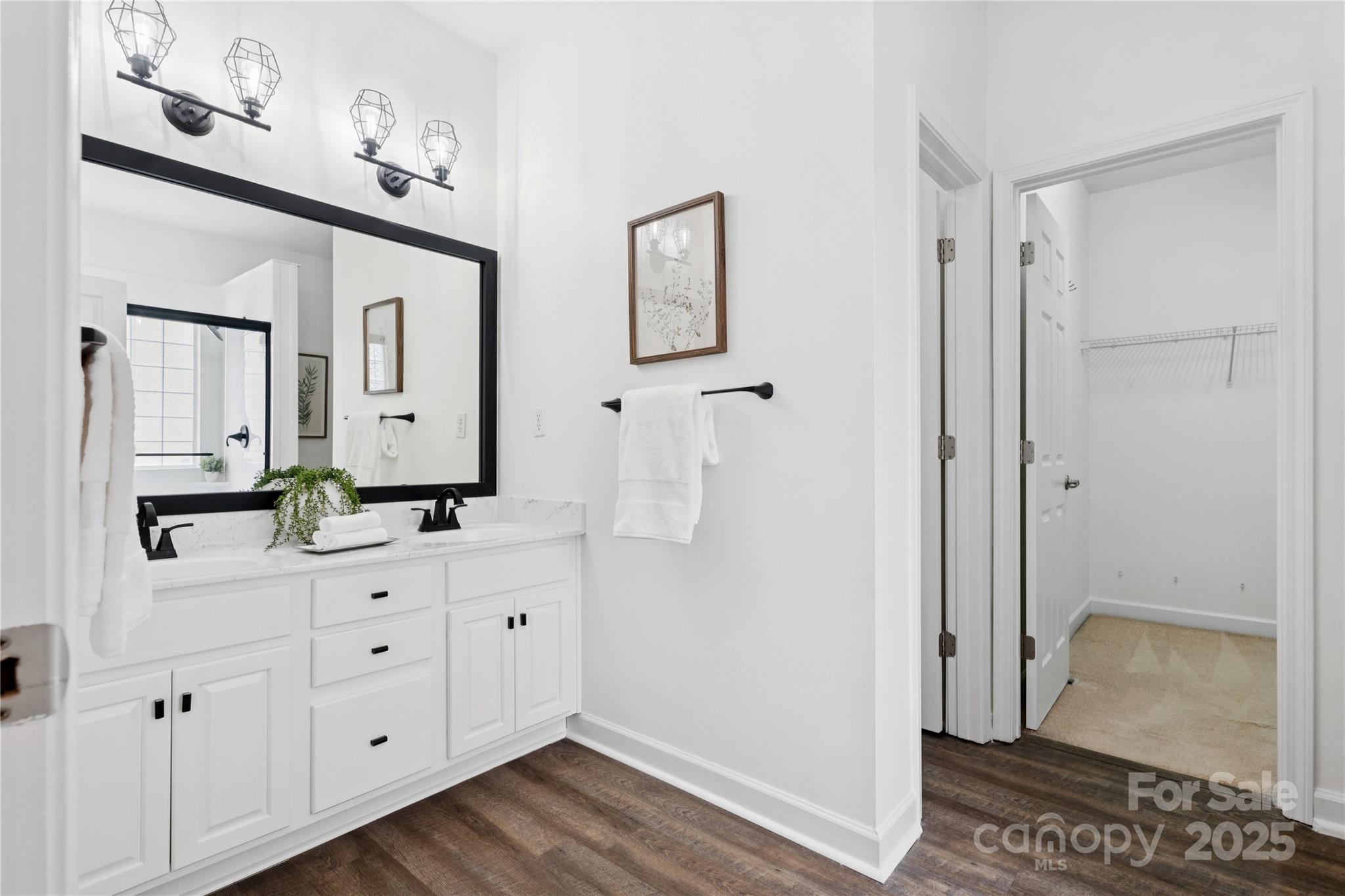 312 Albany Street Fort Mill, SC 29715 - Photo 19 of 36 a spacious bathroom with a double vanity sink a mirror and a shower