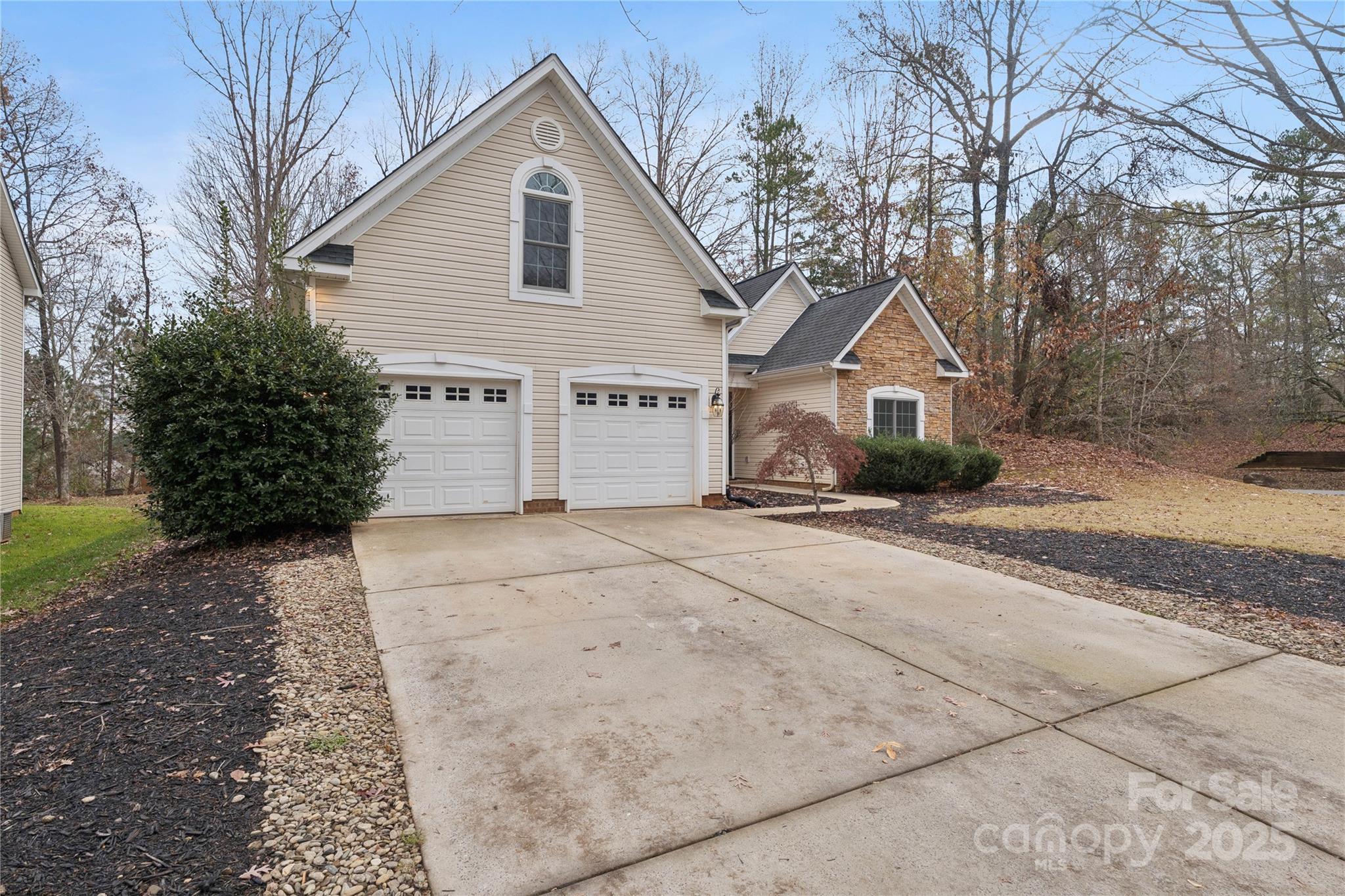 312 Albany Street Fort Mill, SC 29715 - Photo 3 of 36 a front view of a house with a yard and garage