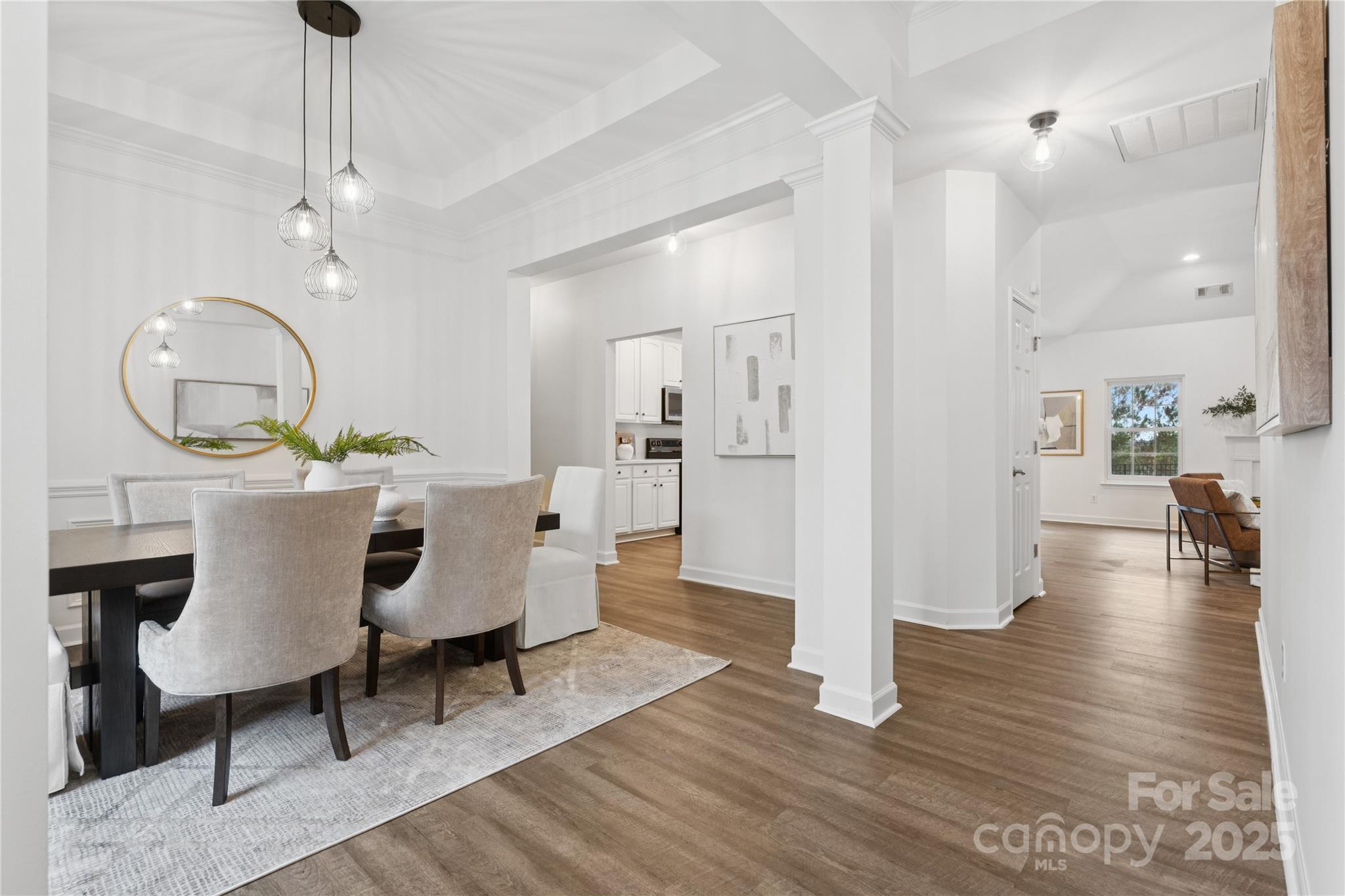 312 Albany Street Fort Mill, SC 29715 - Photo 4 of 36 a view of a dining room with furniture a rug and wooden floor