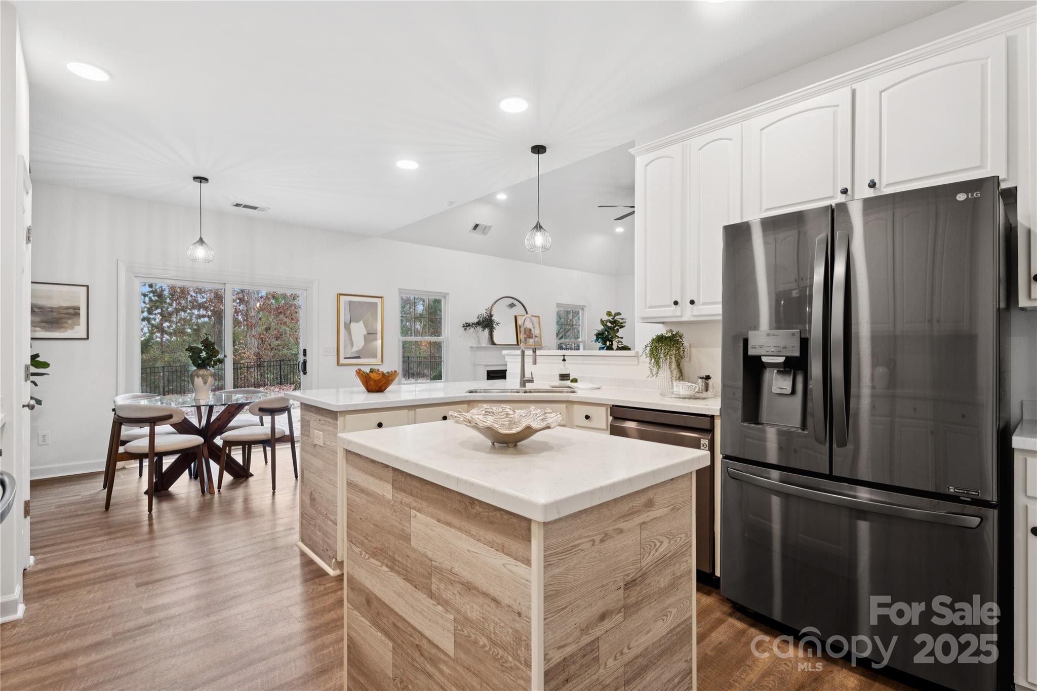 312 Albany Street Fort Mill, SC 29715 - Photo 8 of 36 a kitchen with a refrigerator a sink and chairs