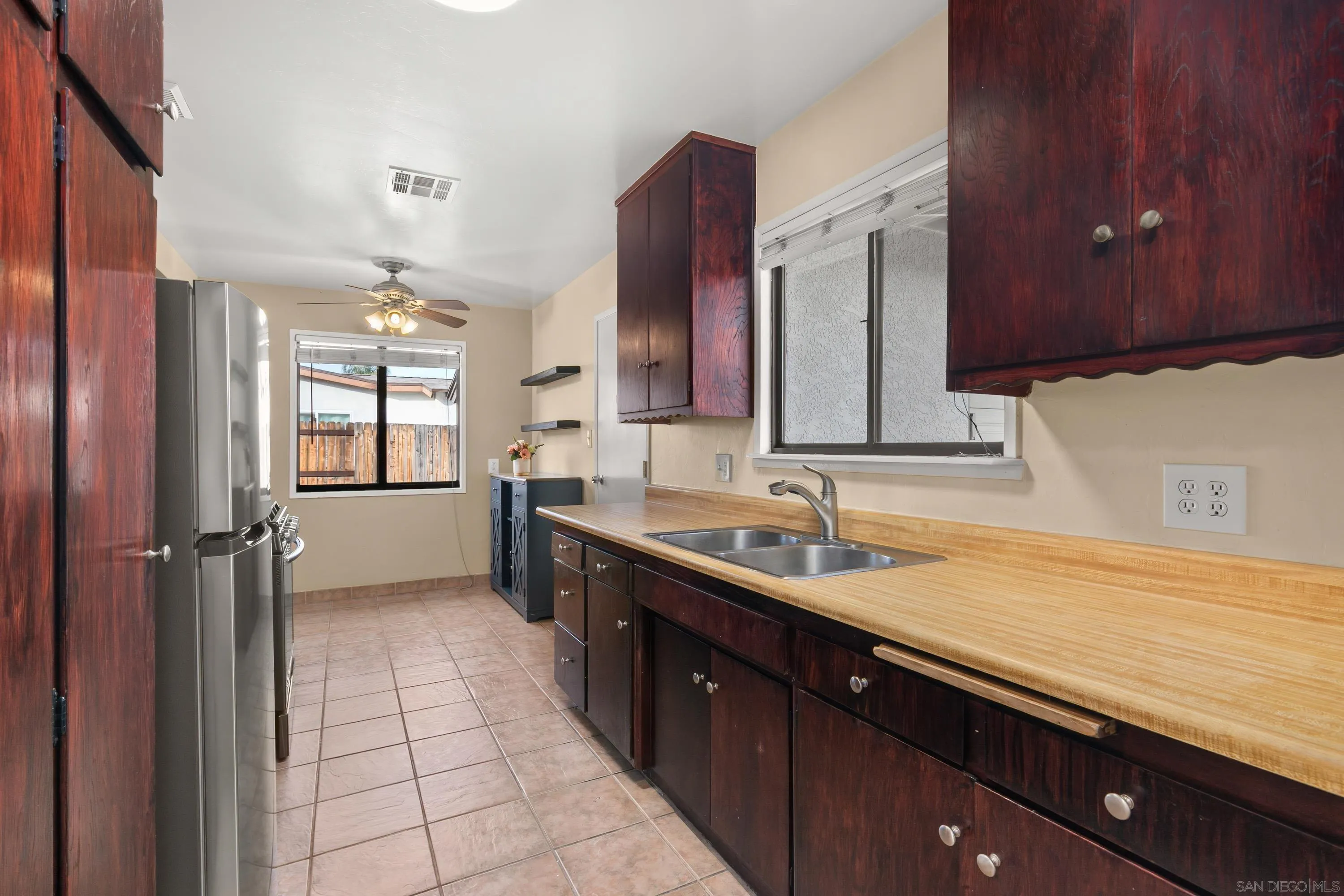 13314 Powers Road Poway, CA 92064 - Photo 14 of 44 a kitchen with a sink and cabinets