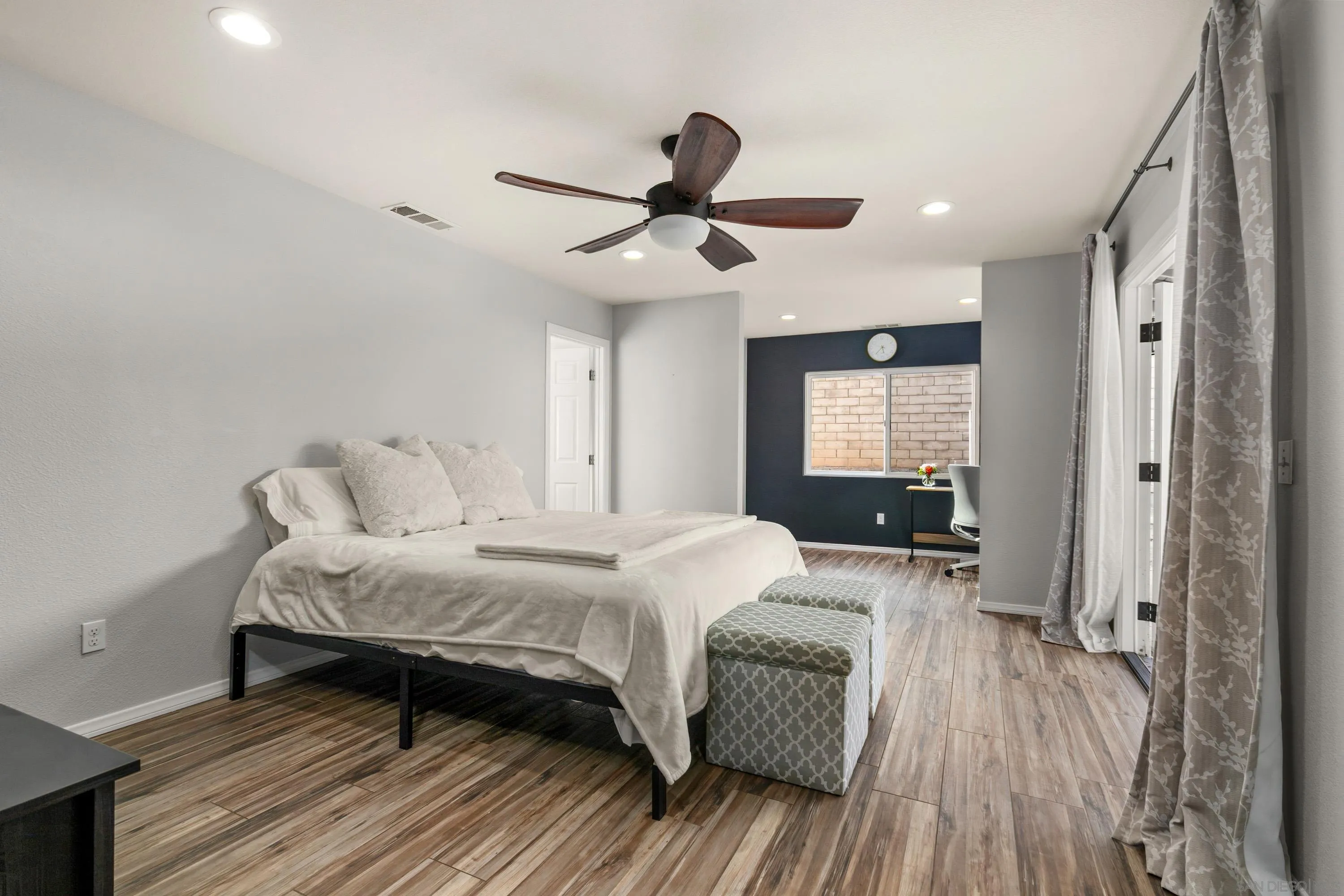 13314 Powers Road Poway, CA 92064 - Photo 16 of 44 a bedroom with a bed and wooden floor