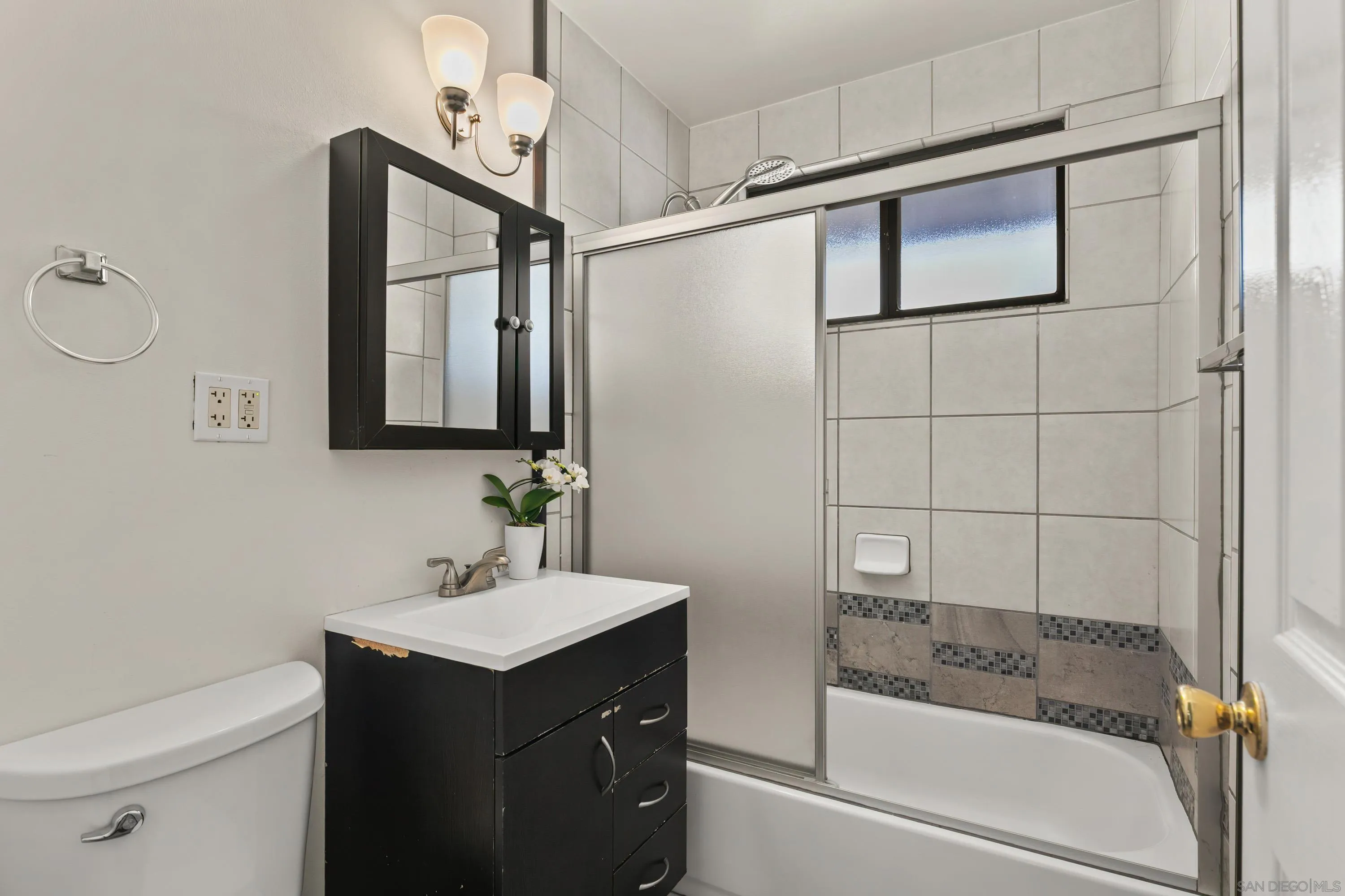 13314 Powers Road Poway, CA 92064 - Photo 23 of 44 a bathroom with a sink a toilet and shower
