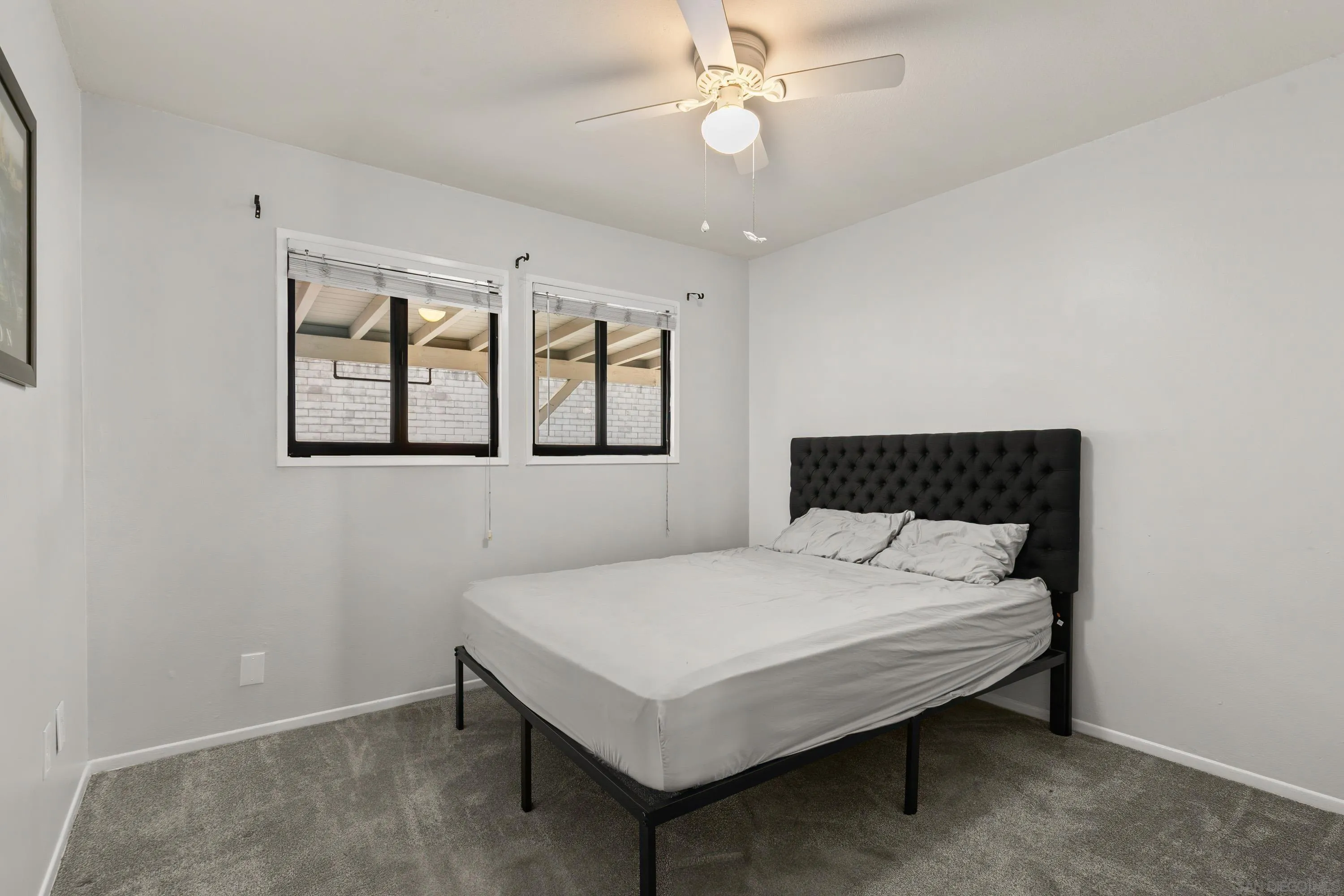 13314 Powers Road Poway, CA 92064 - Photo 24 of 44 a bedroom with a bed and window