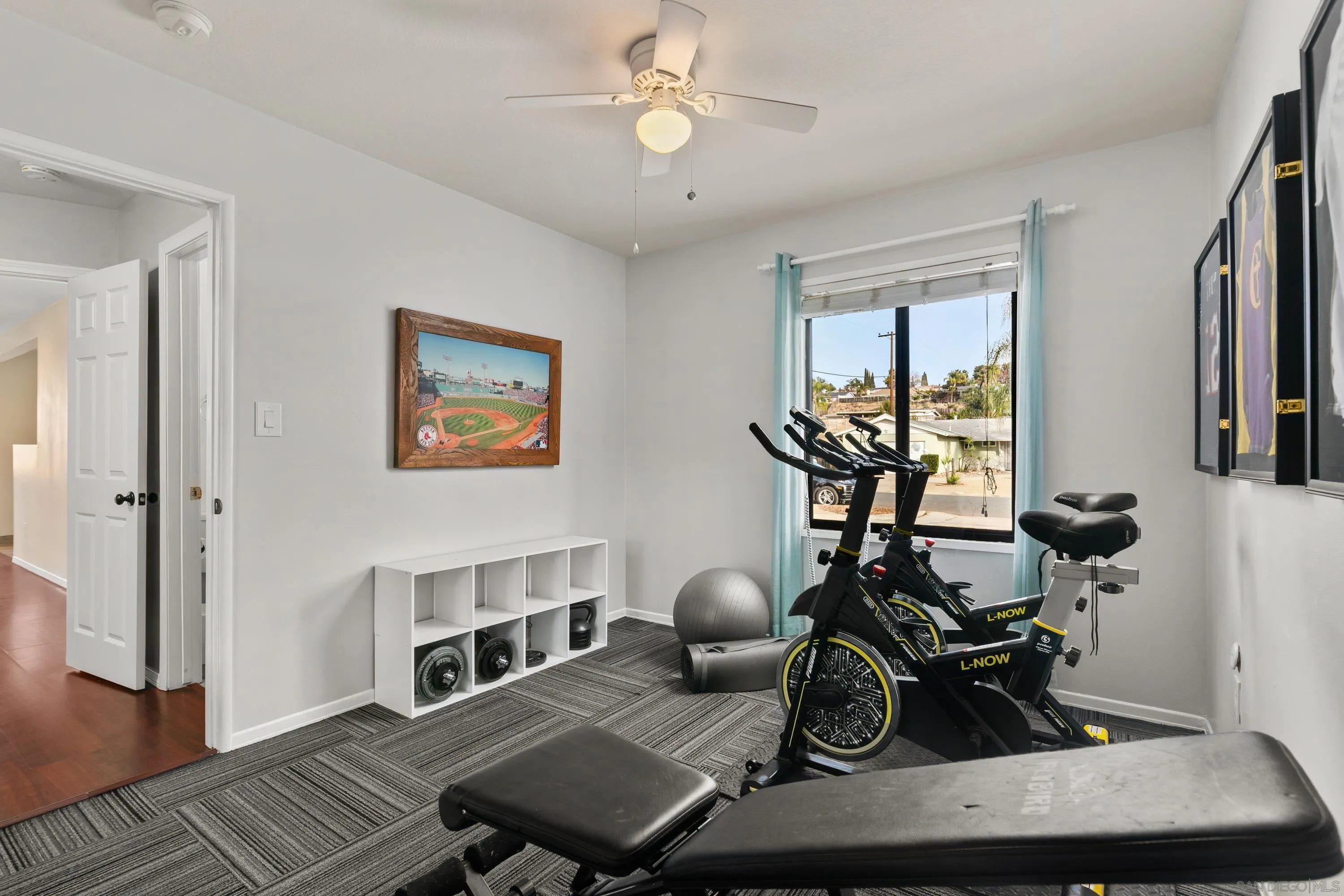 13314 Powers Road Poway, CA 92064 - Photo 27 of 44 a living room with furniture a wooden floor and a chandelier