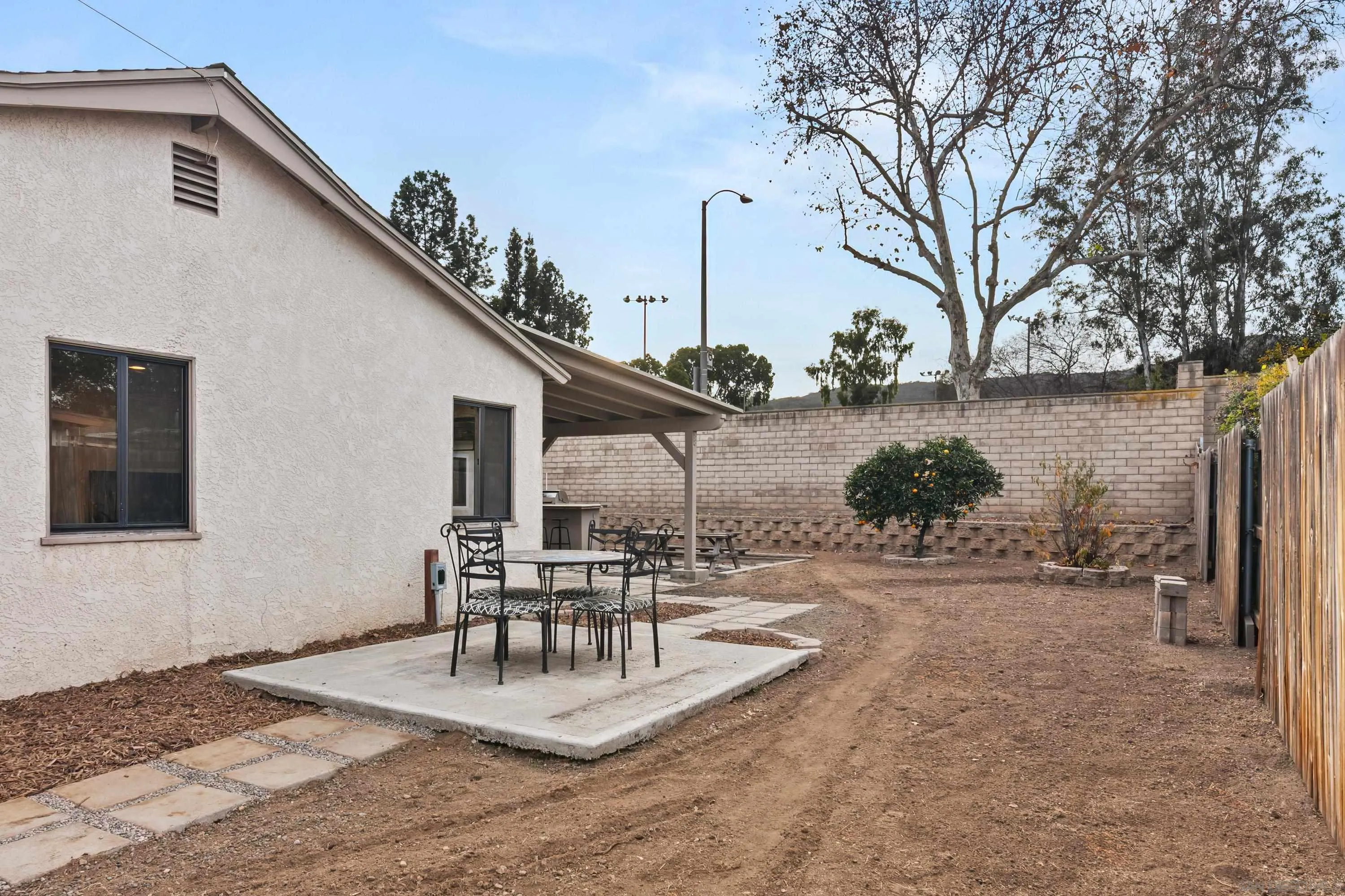 13314 Powers Road Poway, CA 92064 - Photo 32 of 44 a view of a house with backyard and sitting area