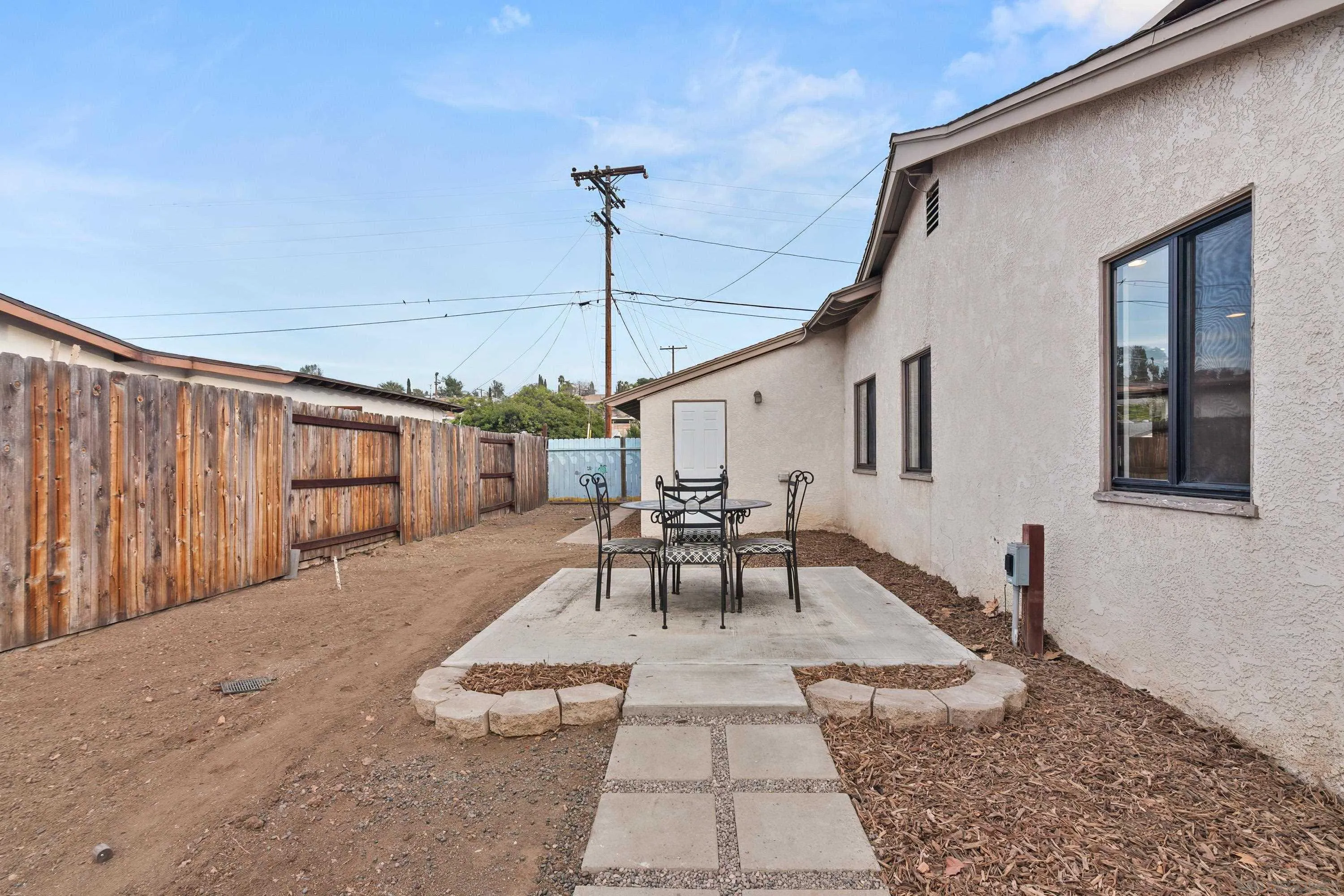 13314 Powers Road Poway, CA 92064 - Photo 33 of 44 a patio with table and chairs