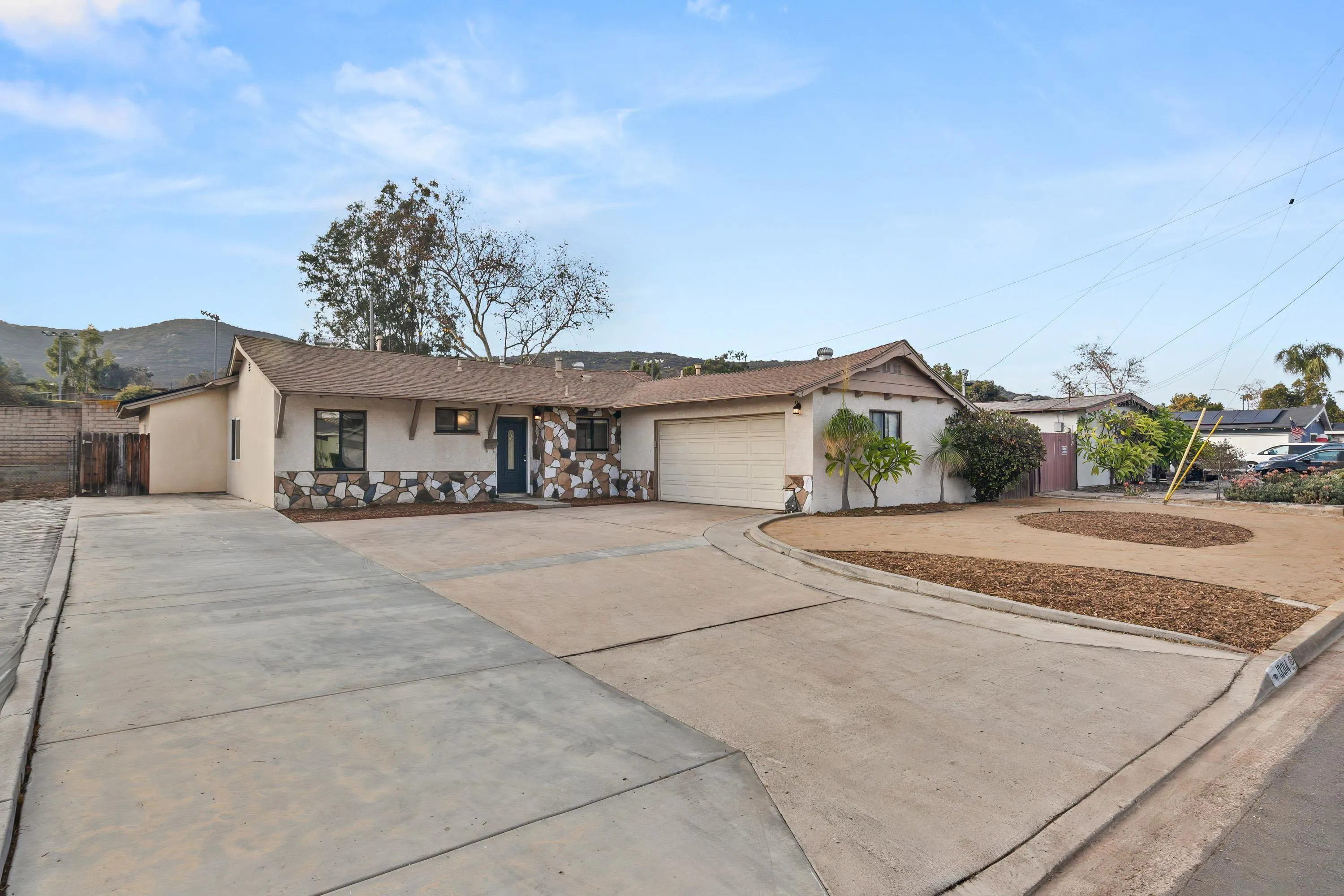 13314 Powers Road Poway, CA 92064 - Photo 37 of 44 a front view of a house with a yard and garage