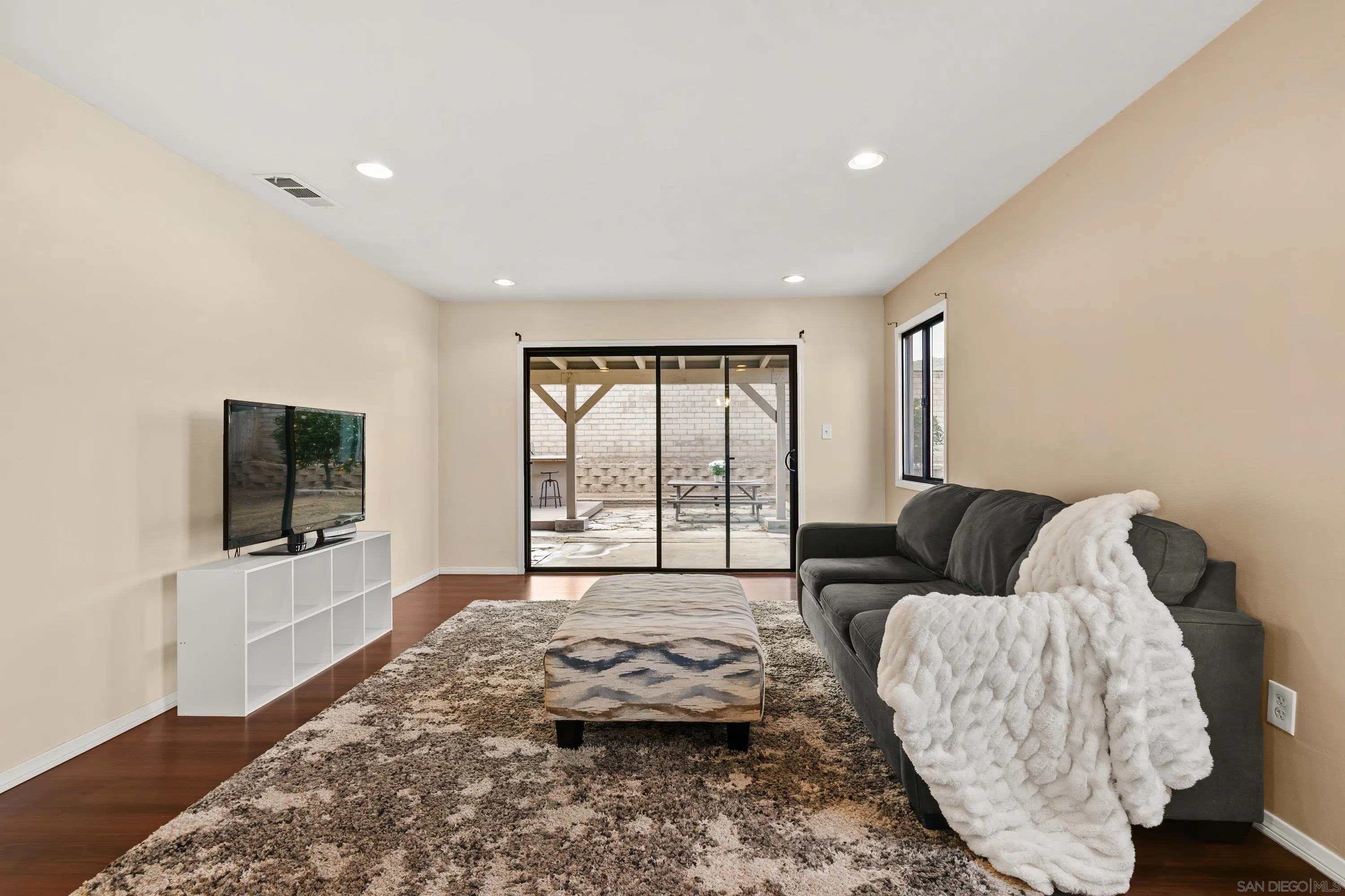 13314 Powers Road Poway, CA 92064 - Photo 9 of 44 a living room with furniture and a flat screen tv
