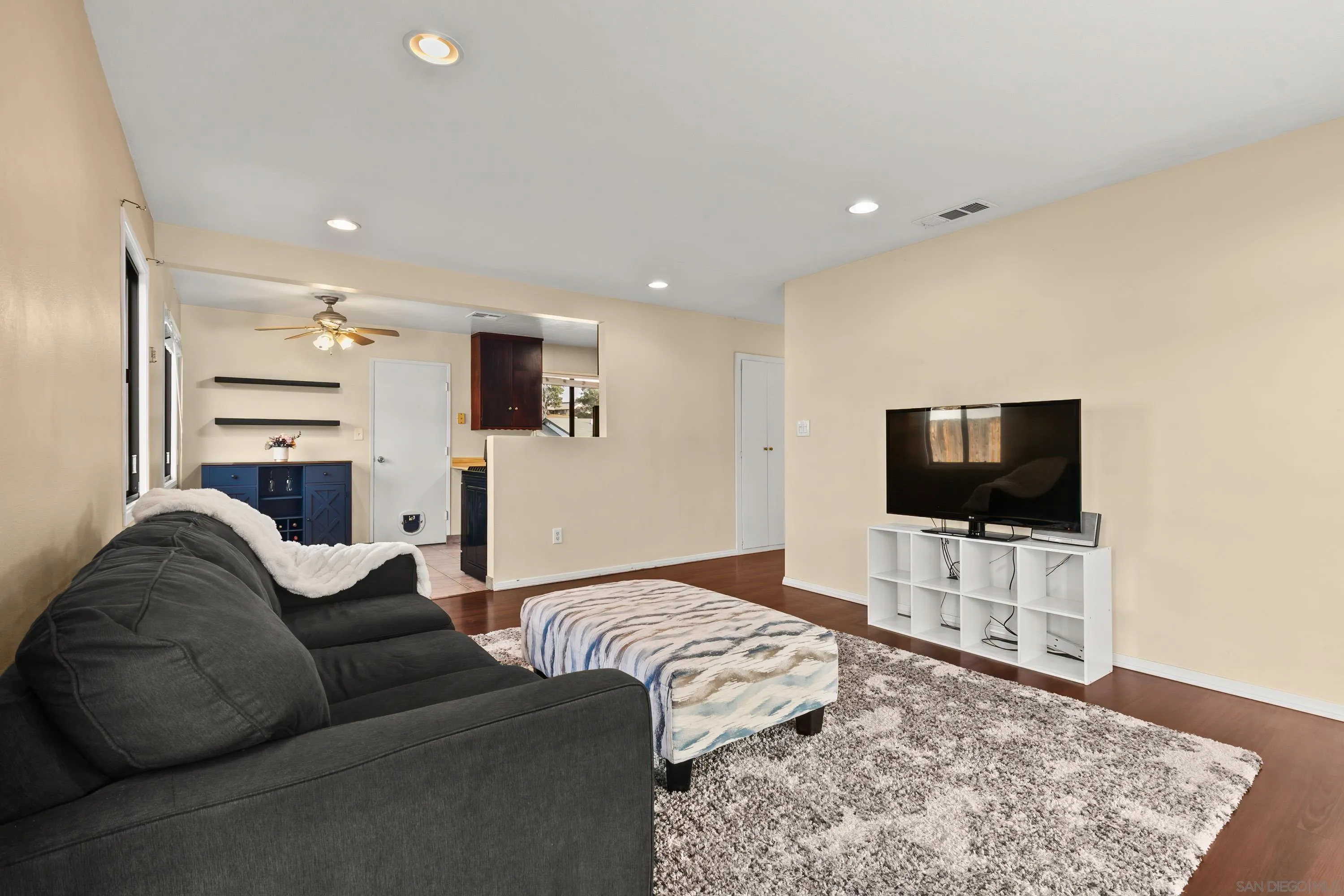 13314 Powers Road Poway, CA 92064 - Photo 10 of 44 a living room with furniture and a flat screen tv