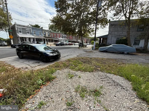 a view of street with parked cars