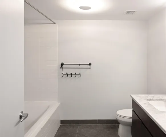 a bathroom with a sink a toilet and a bathtub