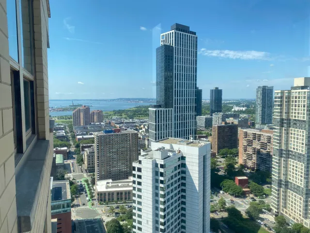 a view of city with tall buildings