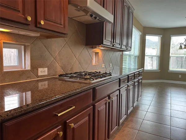 a kitchen with a refrigerator and countertop