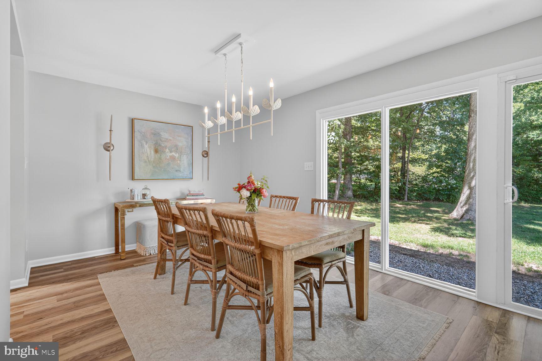 11201 Wedge Drive Reston, VA 20190 - Photo 10 of 31 a view of a dining room with furniture wooden floor and chandelier