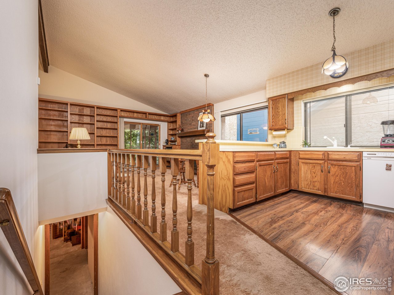 314 Eagle Court Longmont, CO 80504 - Photo 15 of 40 a kitchen with stainless steel appliances kitchen island granite countertop a sink and cabinets