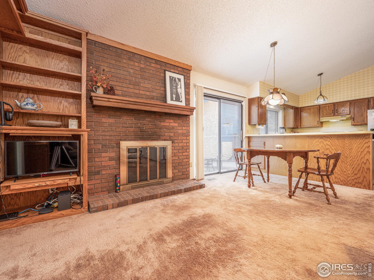 314 Eagle Court Longmont, CO 80504 - Photo 21 of 40 a view of a livingroom with furniture and a fireplace