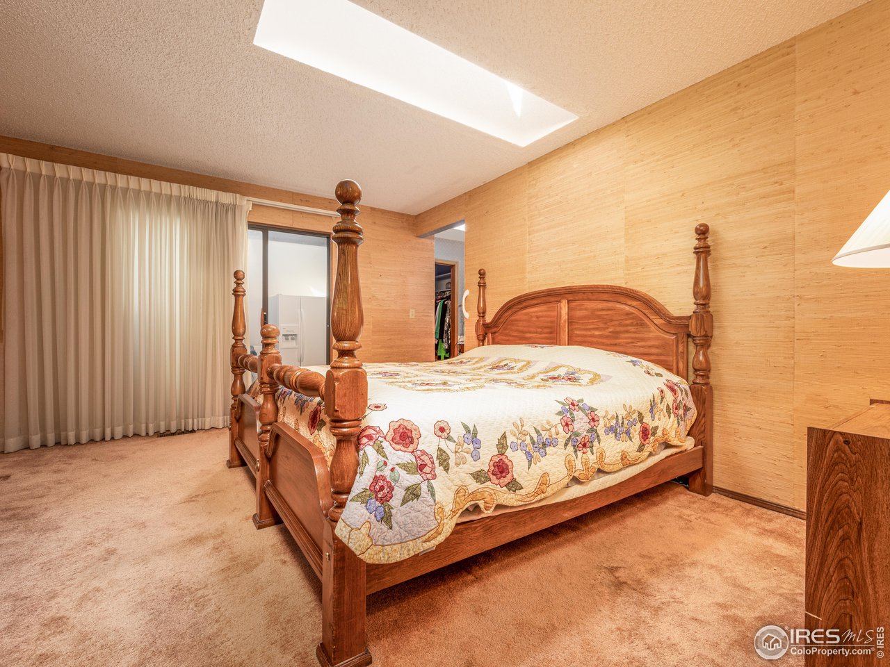 314 Eagle Court Longmont, CO 80504 - Photo 24 of 40 a bed sitting in a spacious bedroom next to a window