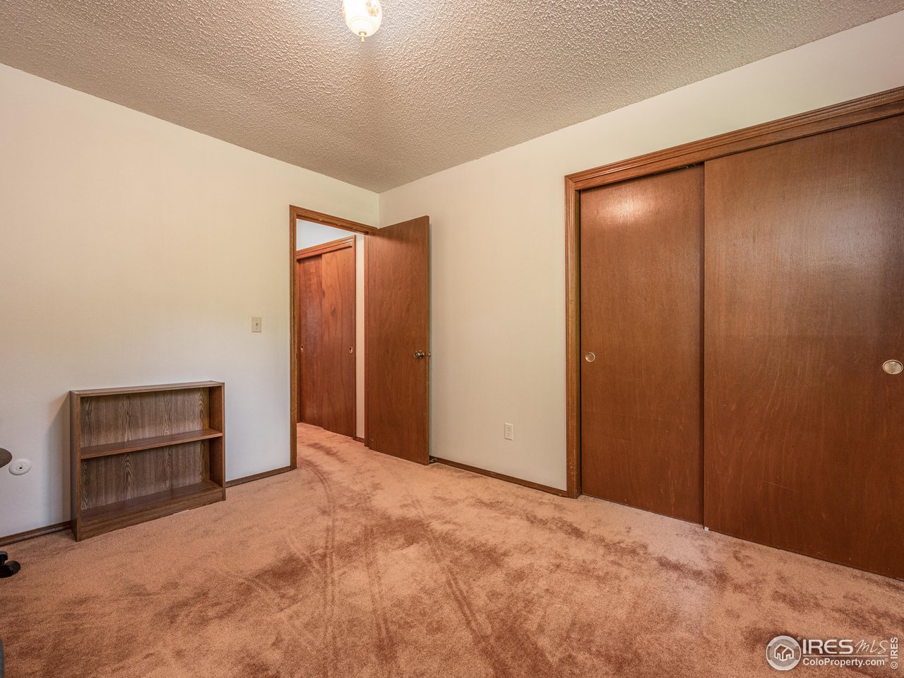 314 Eagle Court Longmont, CO 80504 - Photo 29 of 40 an empty room with closet and a window