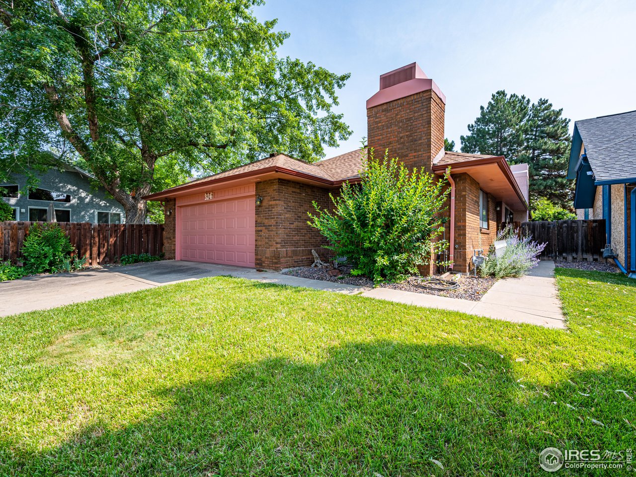 314 Eagle Court Longmont, CO 80504 - Photo 3 of 40 a view of a house with backyard and sitting area