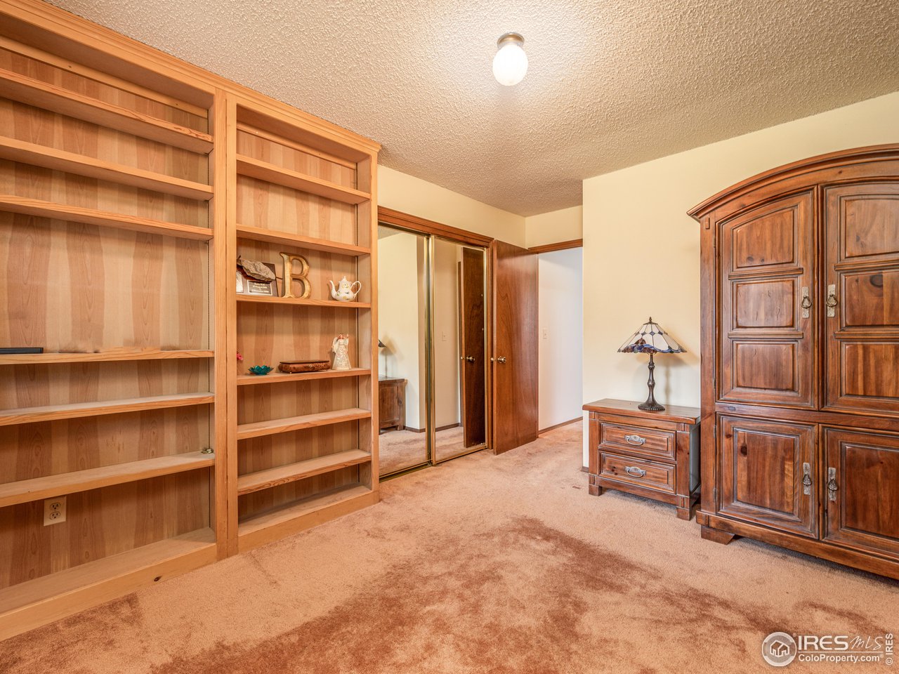 314 Eagle Court Longmont, CO 80504 - Photo 33 of 40 a view of an empty room with cabinet and balcony