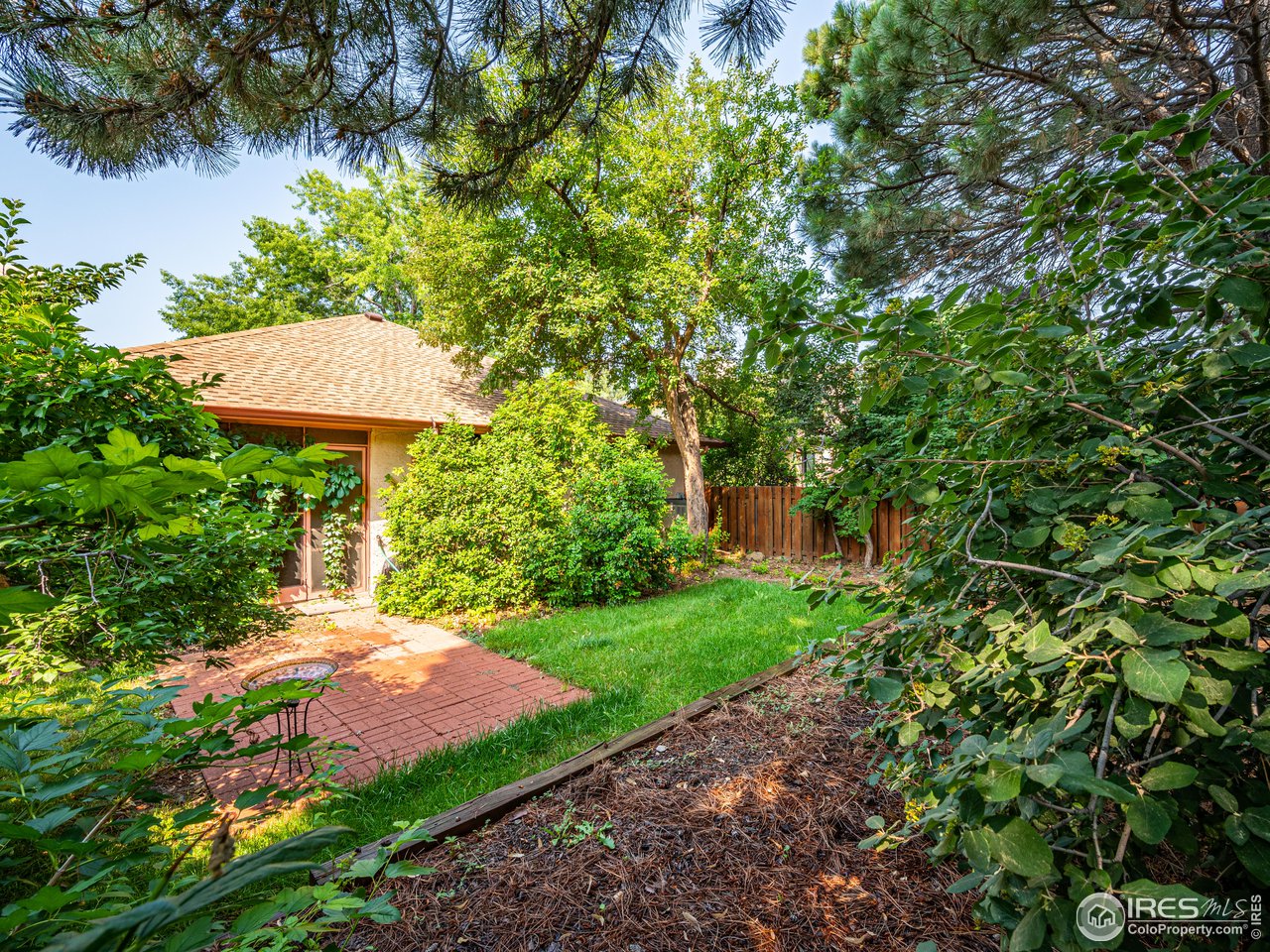 314 Eagle Court Longmont, CO 80504 - Photo 40 of 40 a view of a backyard with plants and a garden