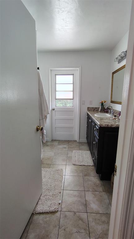 4790 Michael Lane Ponce Inlet, FL 32127 - Photo 13 of 35 a kitchen with a cabinets and a stove top oven