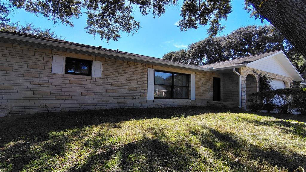 4790 Michael Lane Ponce Inlet, FL 32127 - Photo 22 of 35 a front view of a house with a yard