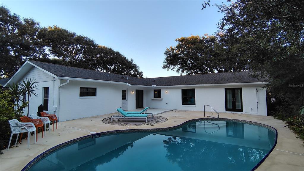 4790 Michael Lane Ponce Inlet, FL 32127 - Photo 3 of 35 a swimming pool with outdoor seating