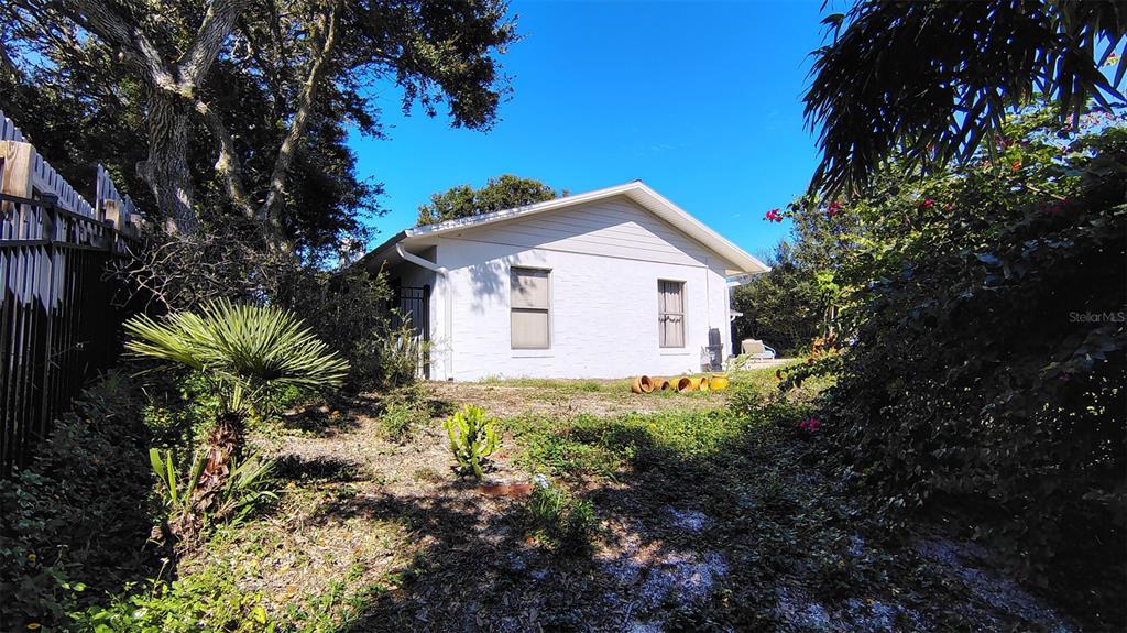 4790 Michael Lane Ponce Inlet, FL 32127 - Photo 33 of 35 a view of a house with a yard