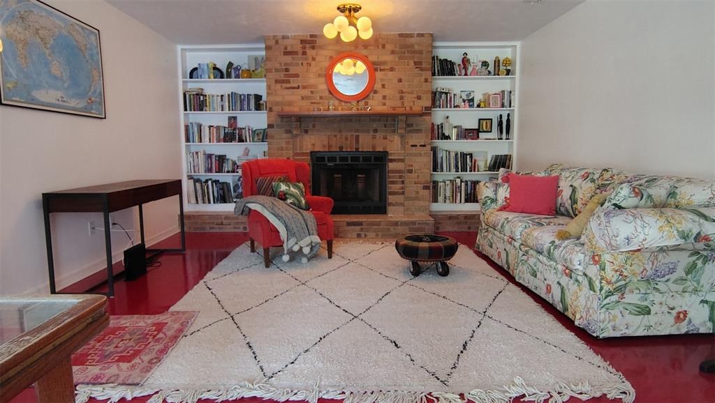 4790 Michael Lane Ponce Inlet, FL 32127 - Photo 9 of 35 a living room with furniture and a fireplace