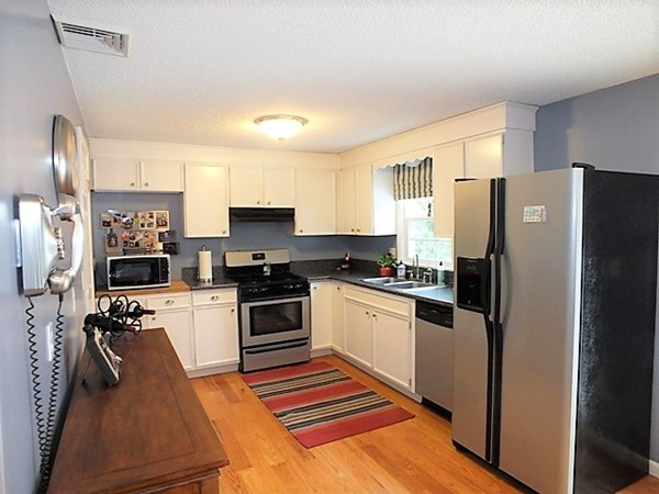 63 Albemarle Road Longmeadow, MA 01106 - Photo 11 of 27 a kitchen with stainless steel appliances granite countertop a refrigerator stove and sink