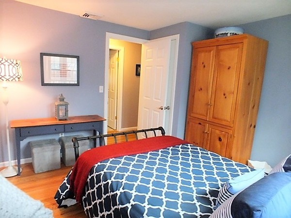 63 Albemarle Road Longmeadow, MA 01106 - Photo 16 of 27 a bedroom with a bed and wooden floor