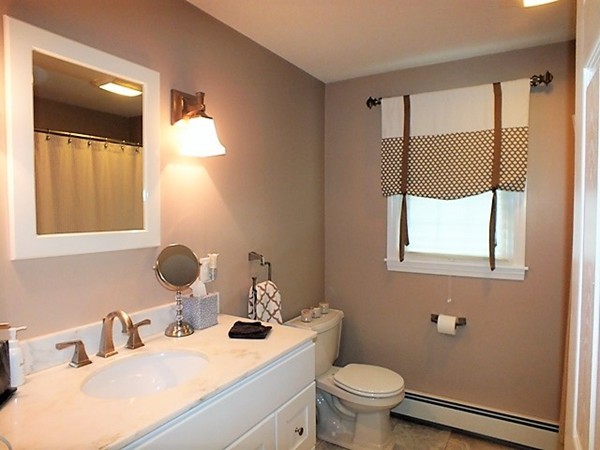 63 Albemarle Road Longmeadow, MA 01106 - Photo 17 of 27 a bathroom with a granite countertop sink toilet and mirror