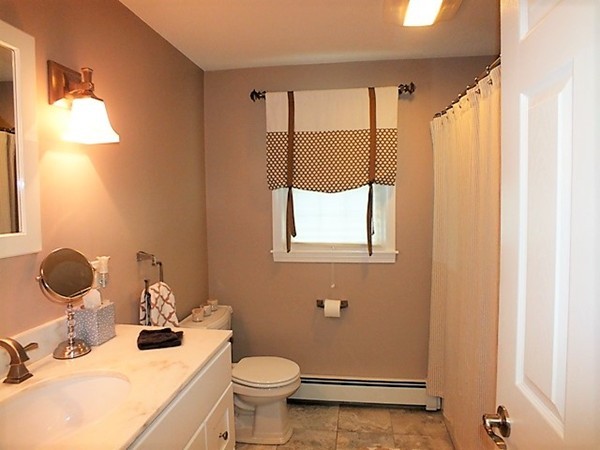 63 Albemarle Road Longmeadow, MA 01106 - Photo 18 of 27 a bathroom with a sink mirror vanity and toilet