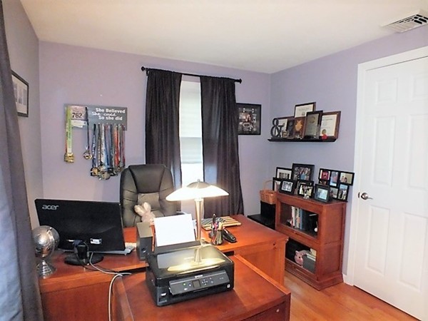 63 Albemarle Road Longmeadow, MA 01106 - Photo 20 of 27 a living room with furniture a rug and a window