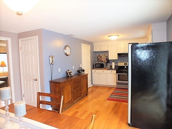63 Albemarle Road Longmeadow, MA 01106 - Photo 8 of 27 a kitchen with stainless steel appliances kitchen island granite countertop a refrigerator and a stove top oven