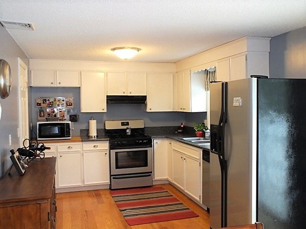63 Albemarle Road Longmeadow, MA 01106 - Photo 10 of 27 a kitchen with a refrigerator stove and sink