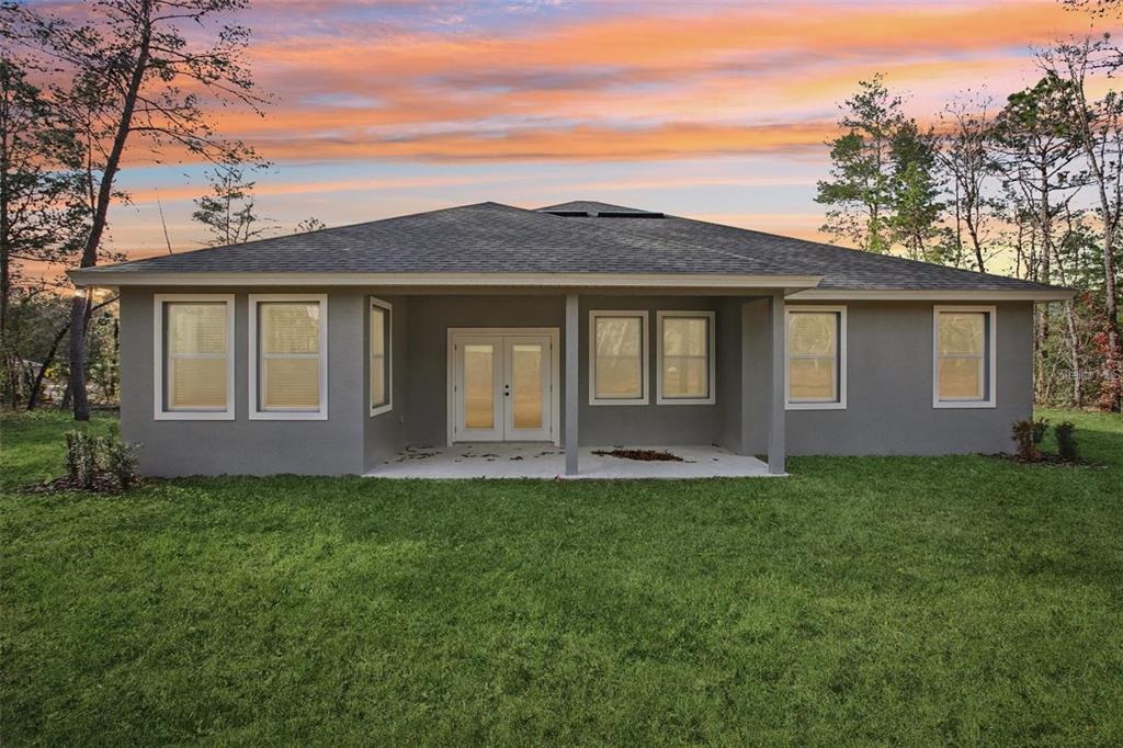 64 Cactus Street Homosassa, FL 34446 - Photo 12 of 12 a front view of a house with a yard